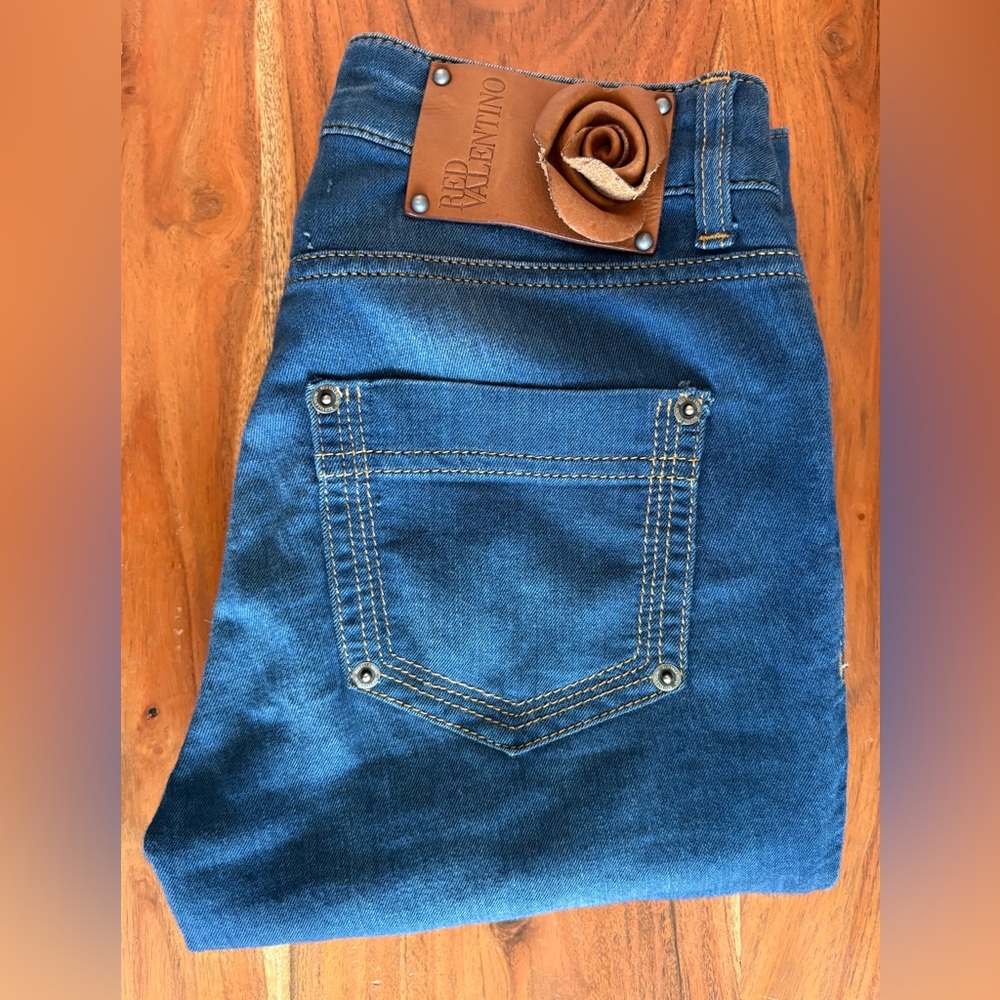 Red Valentino dark blue skinny jeans back brown leather rose label. Fits size 24